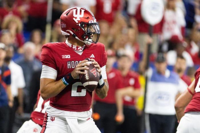 Indiana Hoosiers quarterback Tayven Jackson (2) drops back to pass the ball against the Louisville Cardinals in the second half at Lucas Oil Stadium.